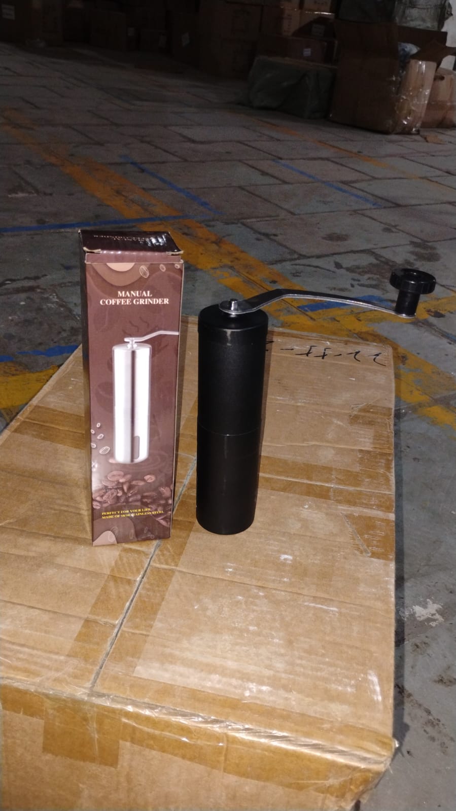 Packaging for the Siplix portable stainless steel manual coffee grinder.
