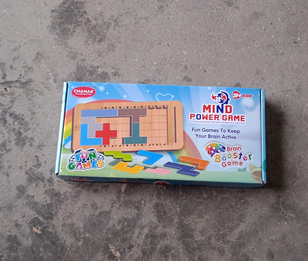 Toddler playing with the wooden mind game, focusing on problem-solving.