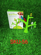 Different colored bird fruit forks arranged decoratively on a plate with fruits.