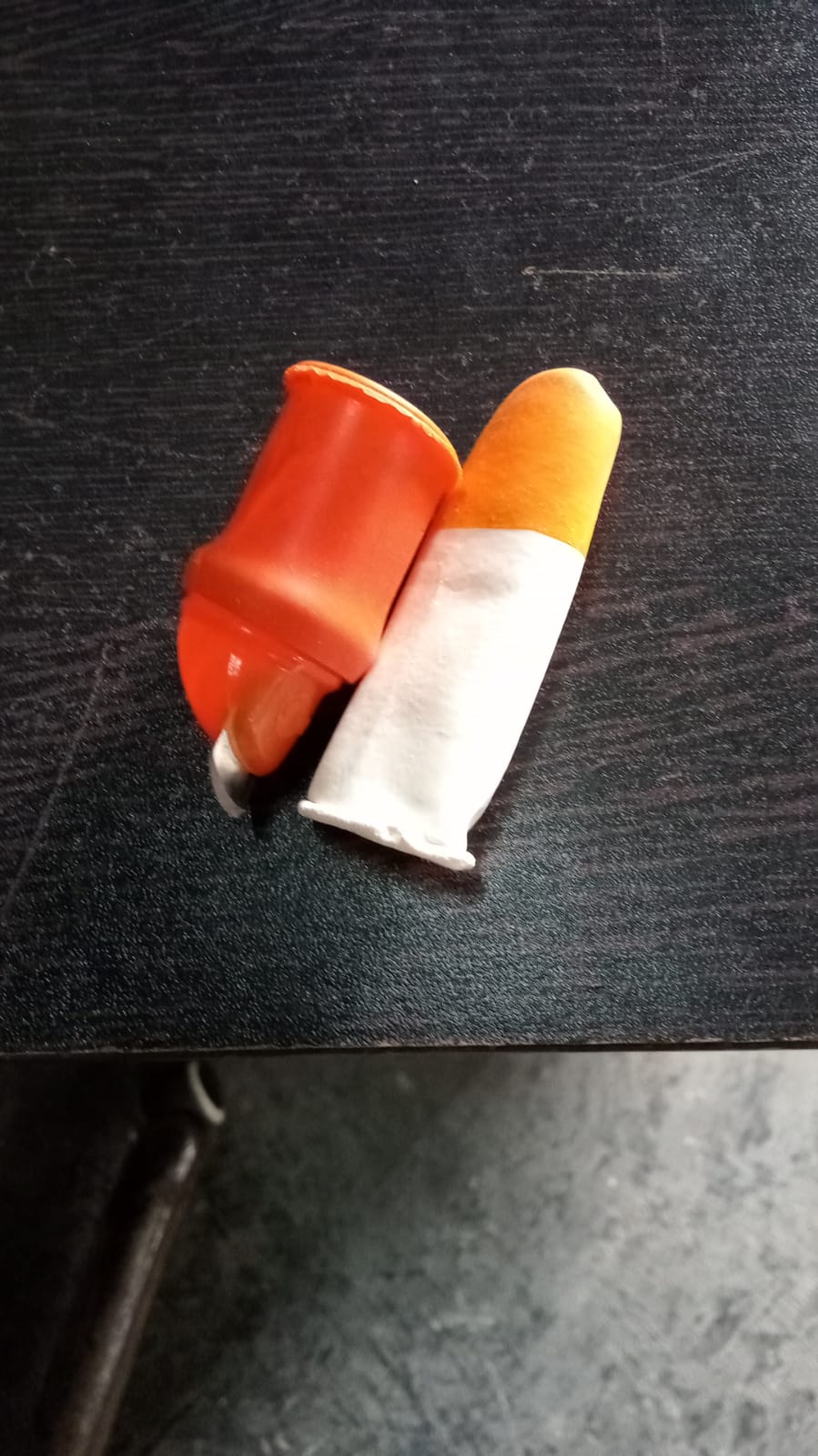 A person wearing the thumb cutter, illustrating its comfortable fit.