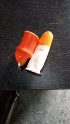 A person wearing the thumb cutter, illustrating its comfortable fit.
