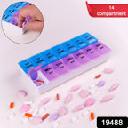 Close-up of pill organizer compartments with bold day and time labels
