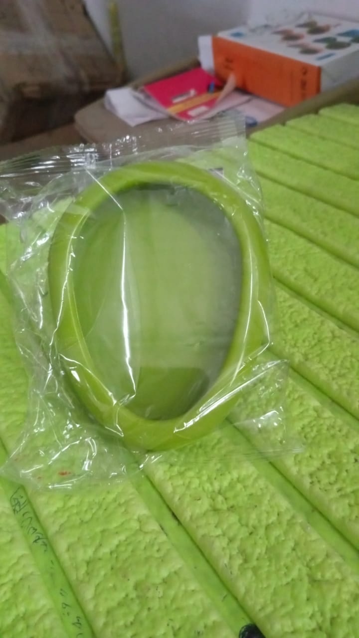 Vertical view of green vegetable container for storage