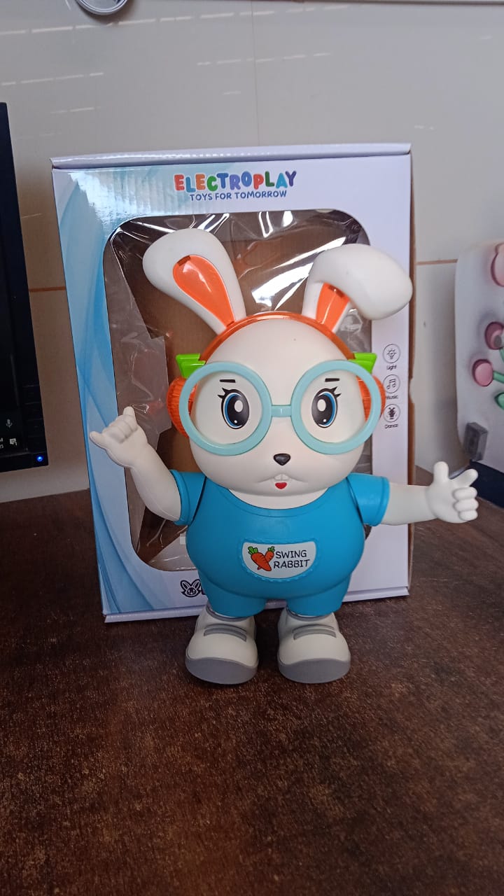 Packaging of Swing Rabbit Musical Dancing Toy displaying product information and design