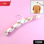 Close-up of padded floral garment hanger showing cushioned satin surface