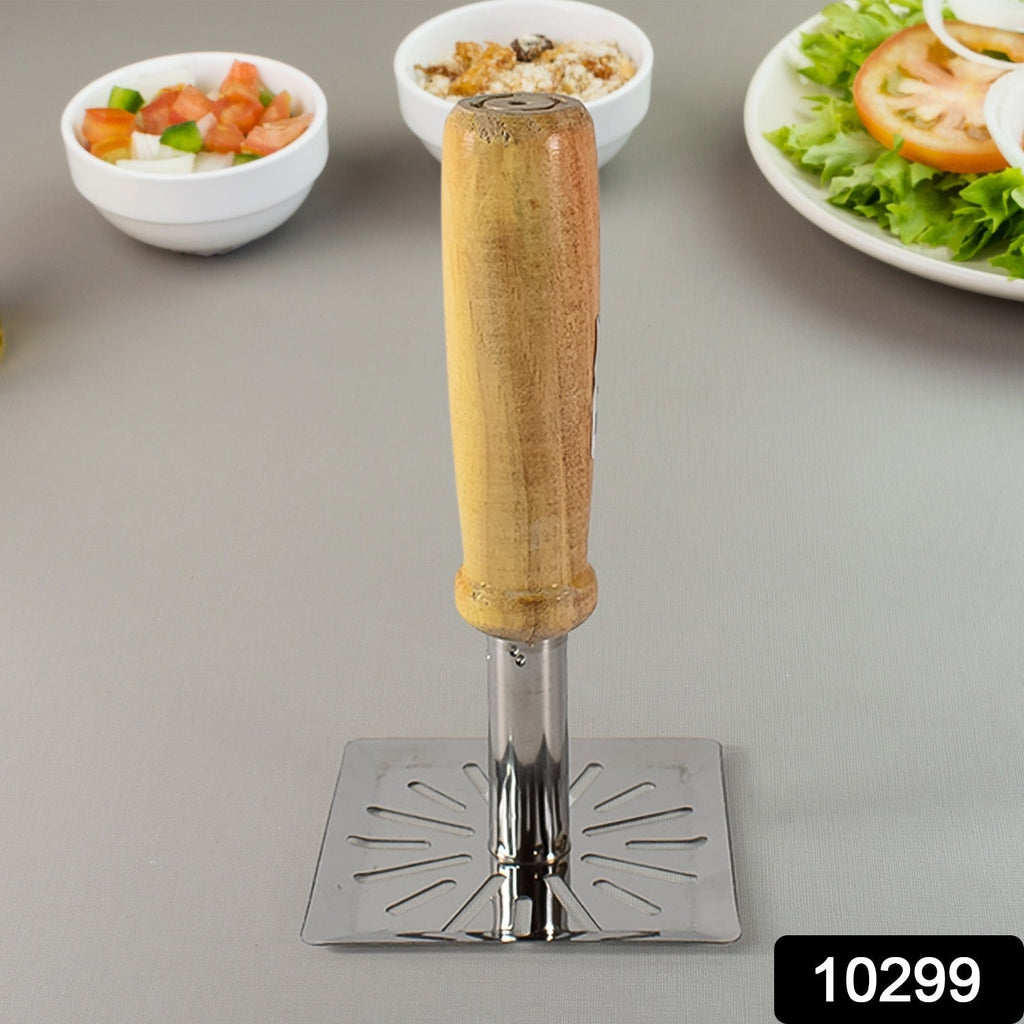 Close-up of the wooden grip on the stainless steel potato masher