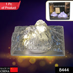 Side view of the Iceberg Night Light, highlighting its textured plastic surface and soft glow.