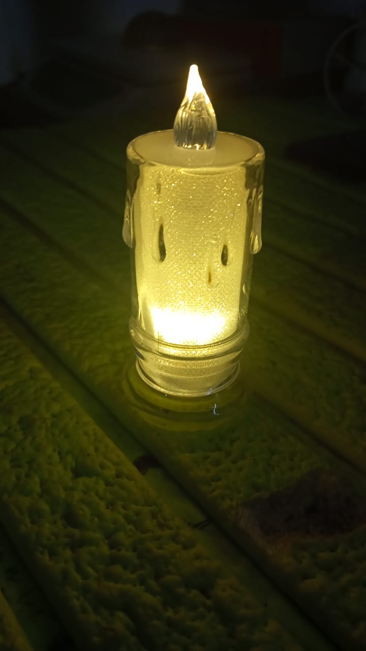 Decorative LED Tea Light Candle illuminating a space with its gentle light.