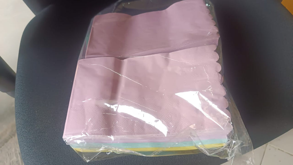 Display of multi-color baking paper sheets for baking and food presentation