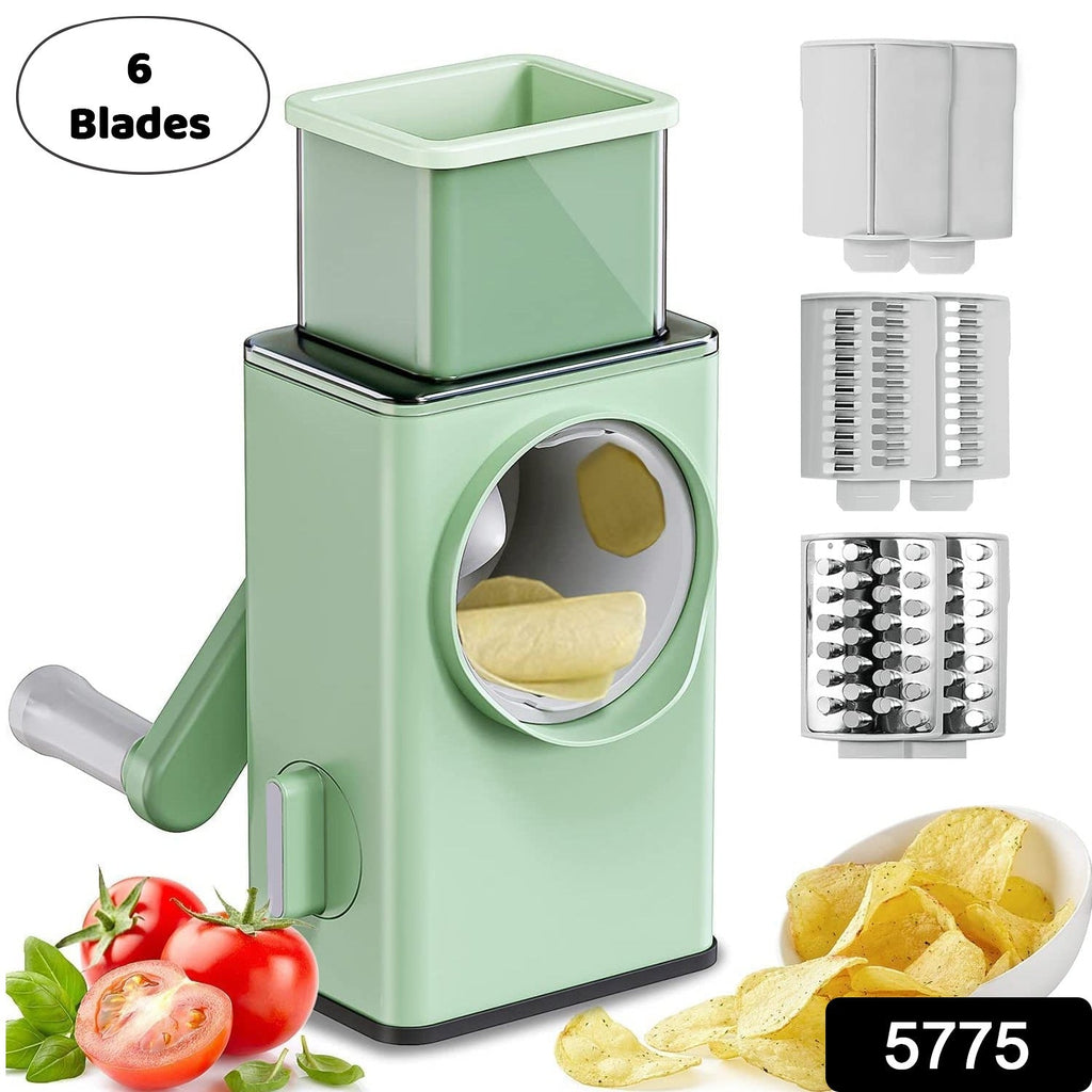 Close-up of the mandoline slicer's rotary handle and food pusher for safe operation.