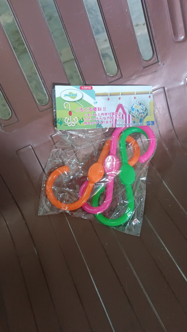 Durable plastic S hooks hanging items in home environment