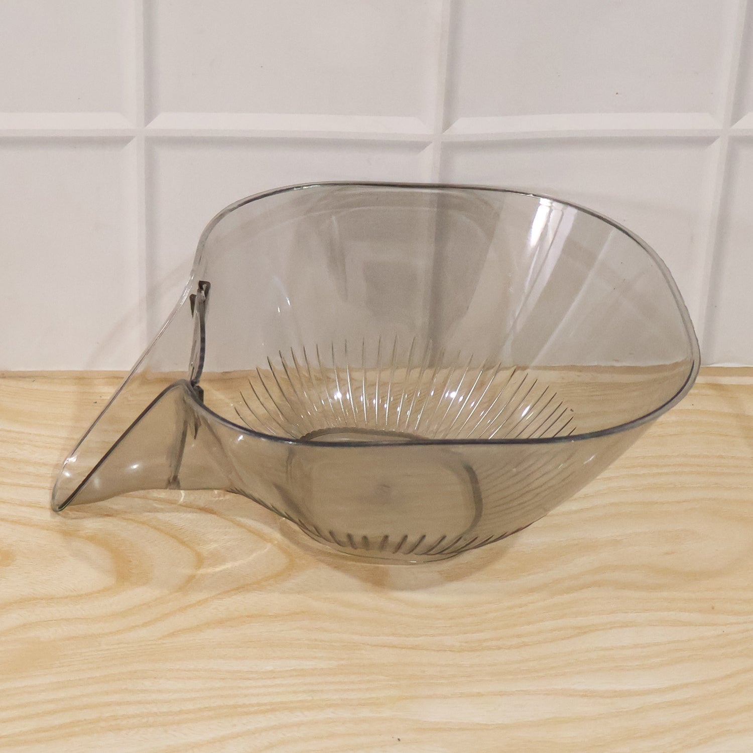 View of the strainer basket draining water in the sink