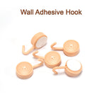 Sticky wall hooks in various home settings like bathroom and kitchen.