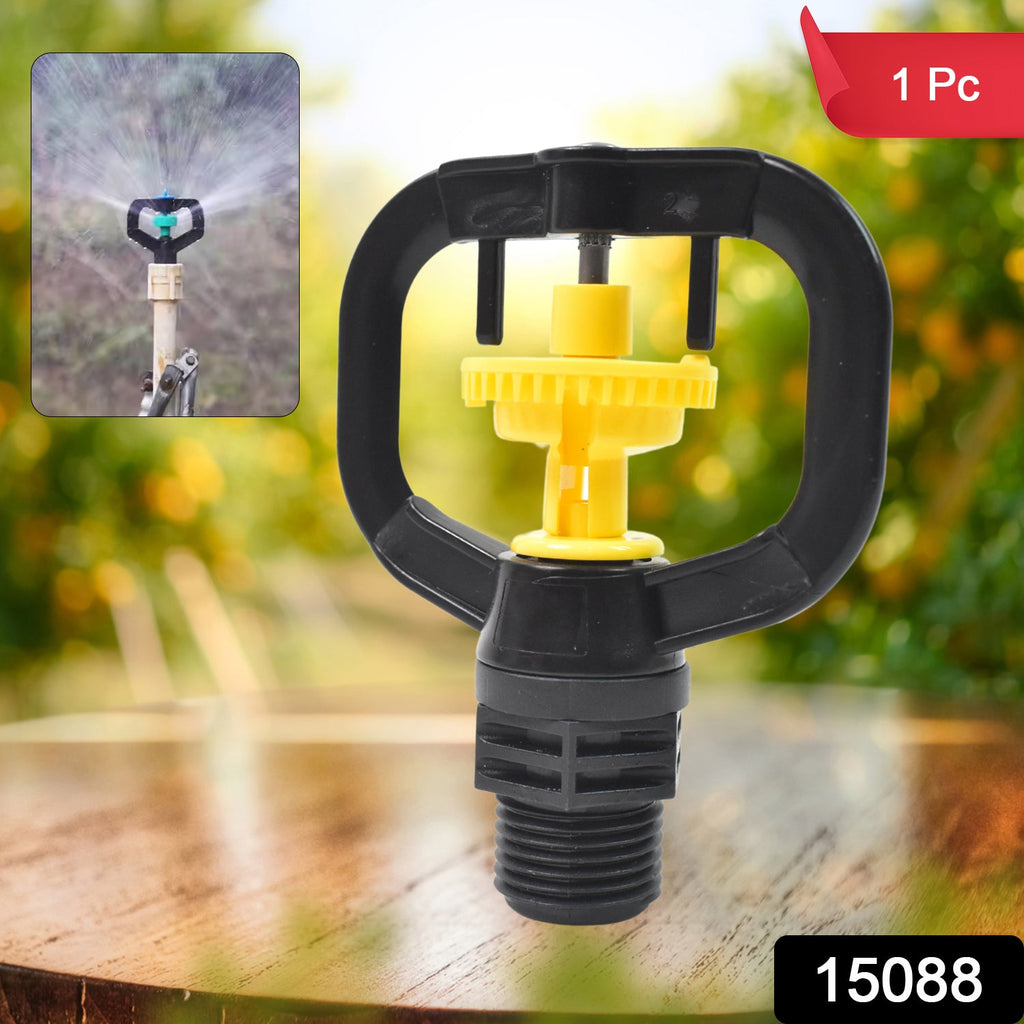 Rotating sprinkler nozzle effectively watering a lush green garden.