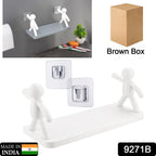Wall-mounted organiser shelf with human figurine, ideal for displaying small items.