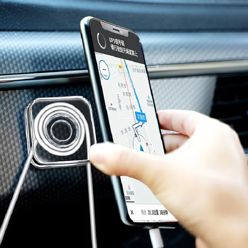 Mobile phone mounted securely on a car dashboard using a transparent nano gel pad.
