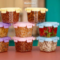 Four colourful 500ml plastic food storage containers with lids, neatly stacked.