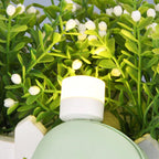 Compact yellow USB LED bulb providing ambient light in a home setting.