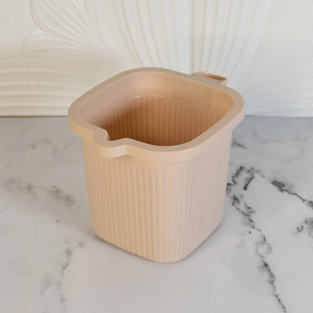 Side view of a clear Plastic Bath Mug, detailing the square base and comfortable grip.