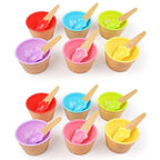 Arrangement of colorful dessert bowls and spoons ready for serving.