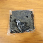 Black pair of compression elbow sleeves folded neatly