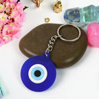 Eye guard key charm in blue silicone with metal ring for car keys