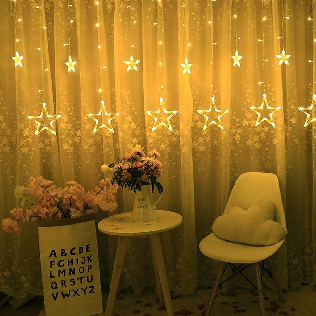 Star-shaped curtain string lights illuminated with multiple flashing modes for ambiance.