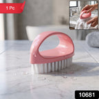 Heavy-duty plastic cleaning brush with ergonomic handle and nylon bristles