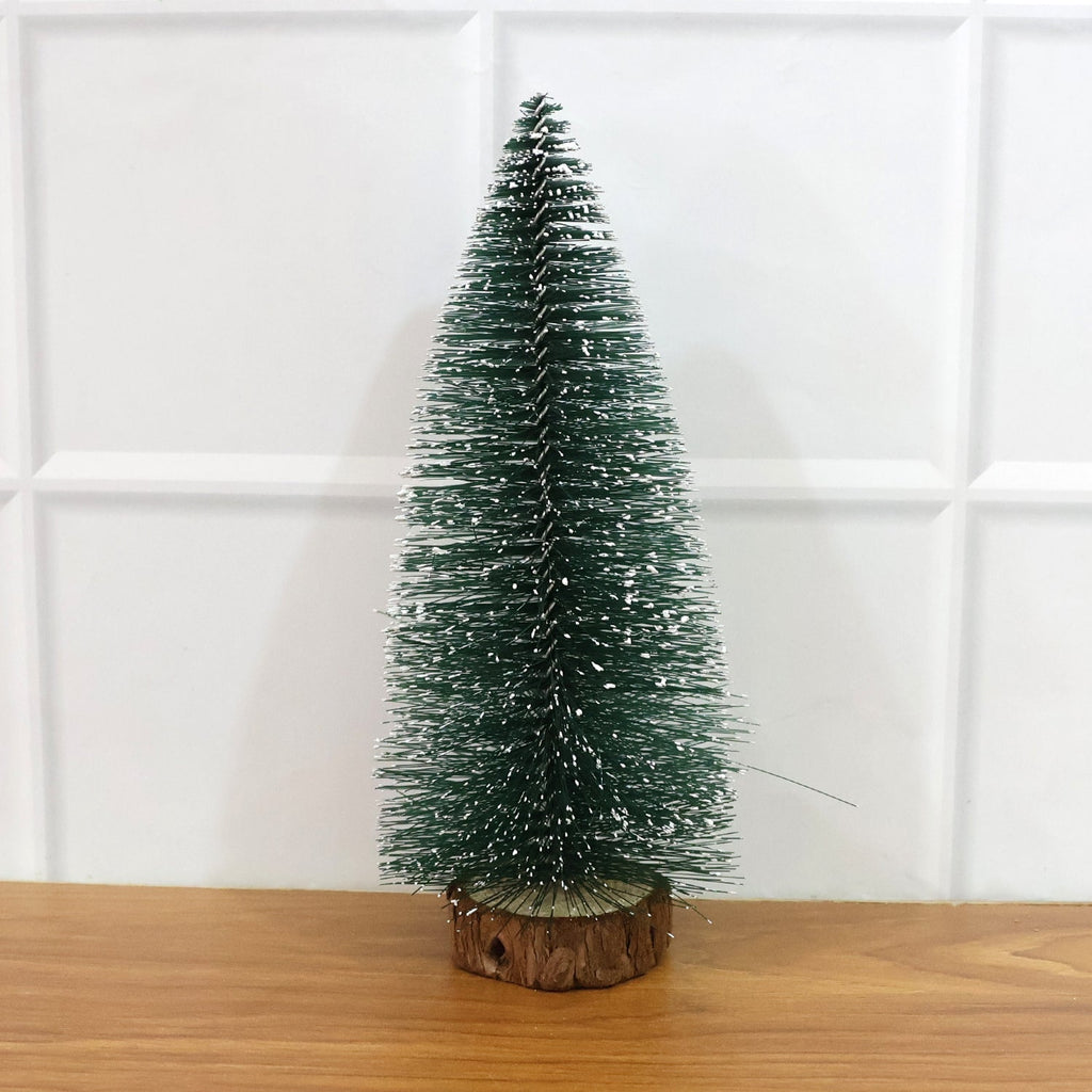 Miniature green Christmas tree with snow effect and sturdy wooden base for festive decor