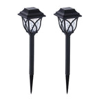 FitFuzion solar pathway lights casting bright, artistic patterns on a dark garden path, enhancing outdoor decor.