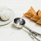 Detailed view of the premium stainless steel ice cream scoop head.