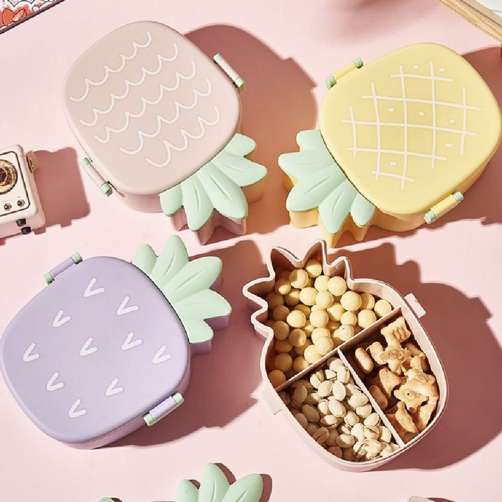 Vibrant pineapple Kids Bento Lunch Box with included fork and spoon.