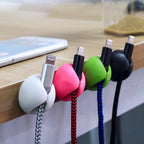 Multiple cable clips demonstrating versatile use for desk cable organization.