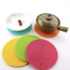 Compact silicone trivet providing kitchen and table protection.