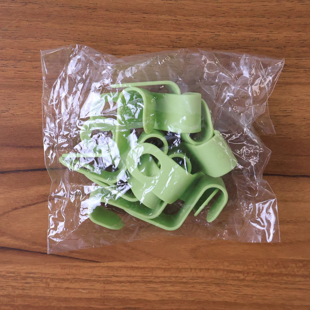 Neatly arranged plastic hanger hooks ready for closet use