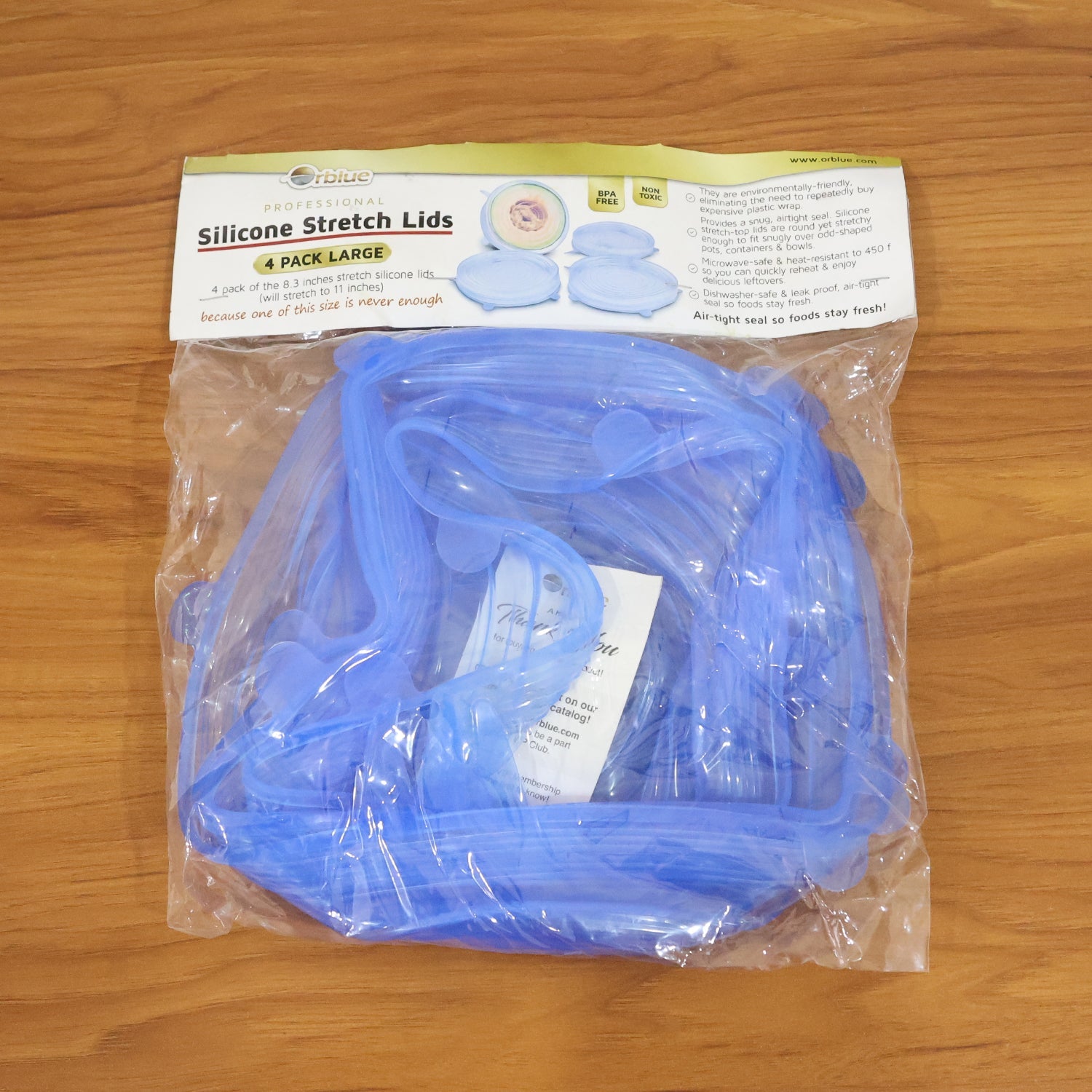 Clear silicone stretch lids protecting leftover food in containers
