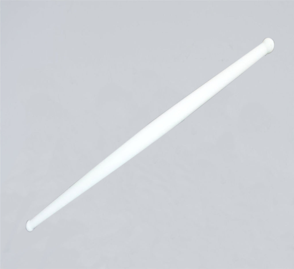 Clean white plastic rolling pin resting on a modern kitchen countertop, ready for use.