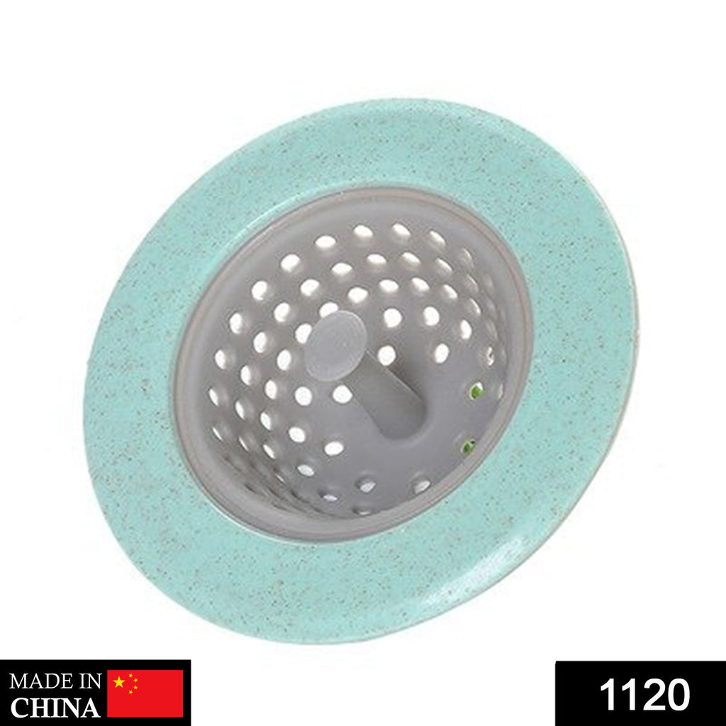 Close-up of a durable silicone sink strainer with a handlebar and fine mesh holes.