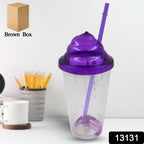 Side view of a stylish plastic cold drink tumbler featuring its secure lid and reusable straw.