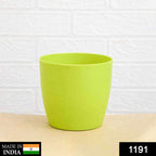 Close-up of a versatile round plastic flower pot, perfect for various gardening needs.