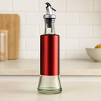 Glass oil dispenser with plastic covering and golden pour spout, 300ml capacity