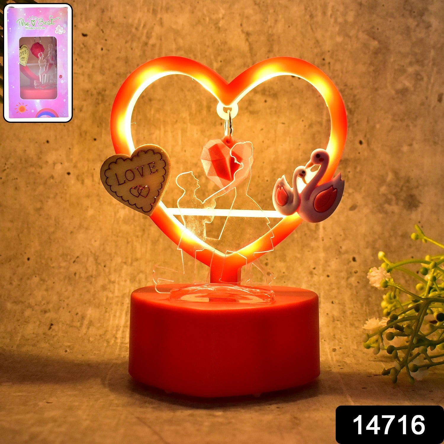 Close-up of heart LED showpiece on table creating romantic ambiance