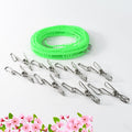 Set of stainless steel clothes pegs with rope for laundry