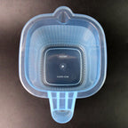 Lifestyle shot of transparent plastic mugs in a modern bathroom setting, emphasising hygiene.