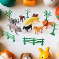 14-piece Animal Kingdom toy set featuring realistic wild animals, trees, and fences