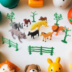 14-piece Animal Kingdom toy set featuring realistic wild animals, trees, and fences