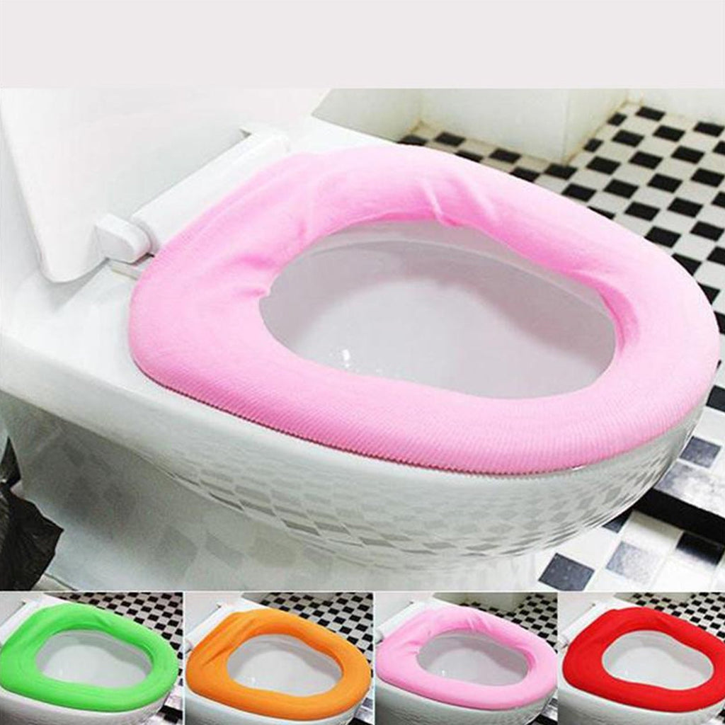 Lifestyle image showing a comfortable, warm toilet seat cover in a modern bathroom setting.
