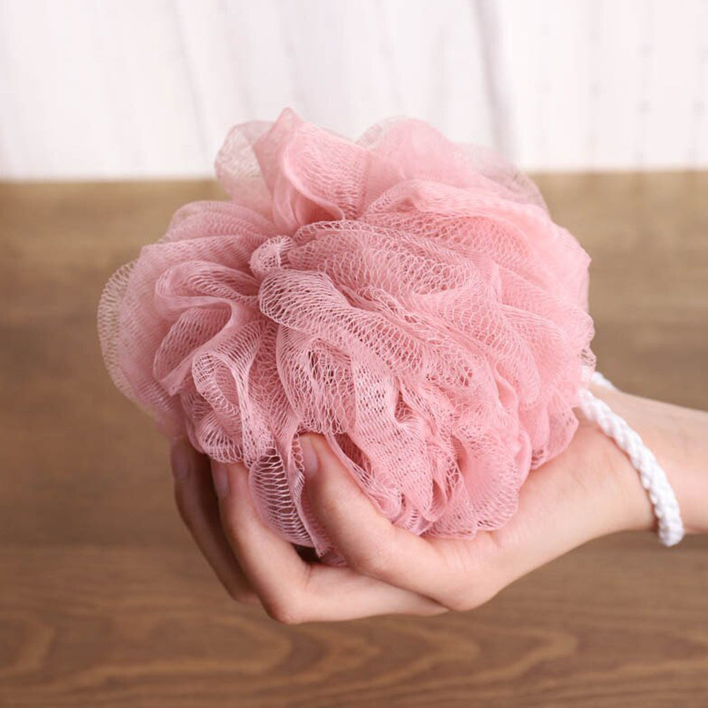 Ergonomic back scrubber with a soft loofah sponge for easy use.