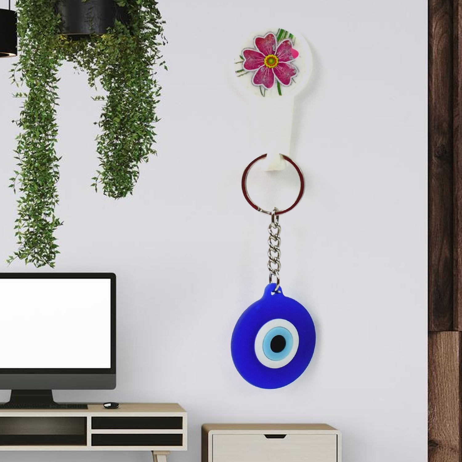 Evil eye charm keychain attached to keys showing protective amulet design