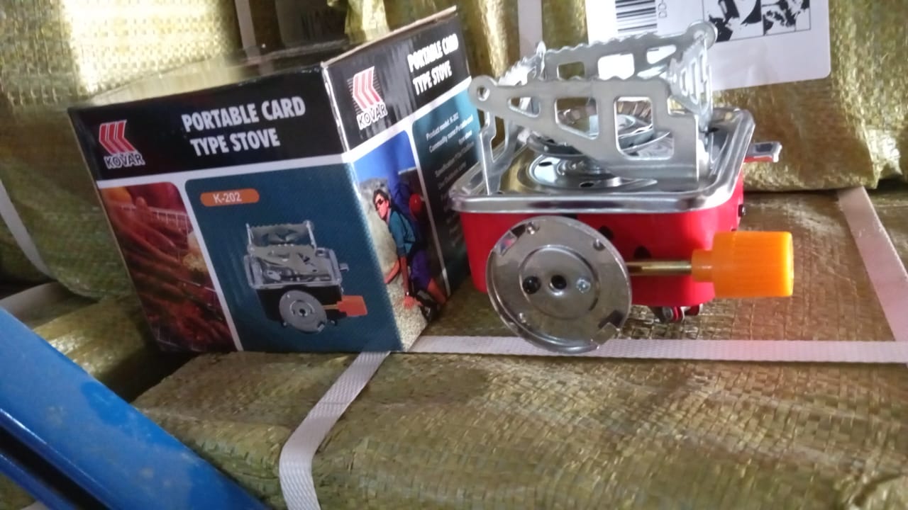An alternative angle of the Mini Camping Stove, emphasizing its compact folded size for easy transport.